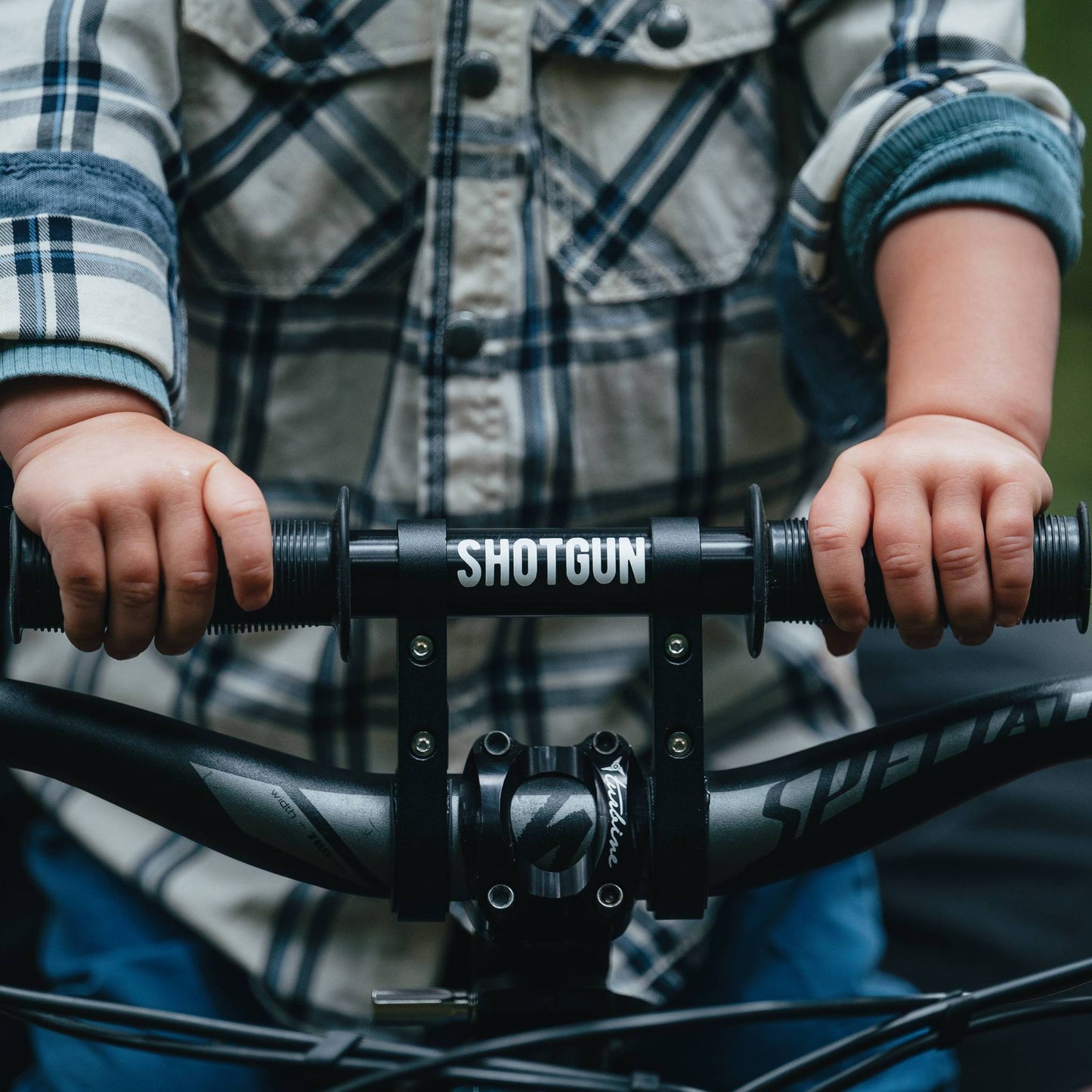 Shotgun Child Bike Handlebars Riding On Trail With Parent Close Up